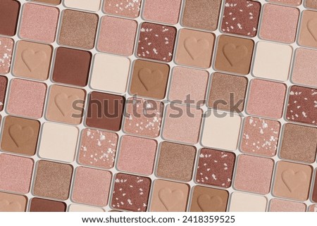 Eye shadows beige color swatches, creative cosmetic texture background, different shiny and matte eyeshadow, trend geometric pattern, aesthetic beauty template, neutral color powder for makeup, above
