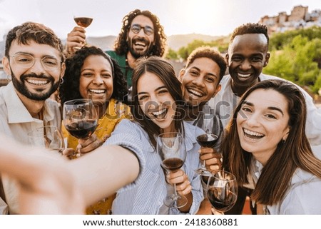 Multiracial friends drinking red wine outside at farm house vineyard countryside - Group of young people taking selfie picture outdoor - Life style concept with guys and girls enjoying summer vacation