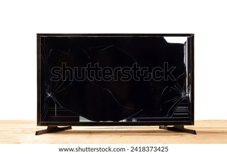 Television LCD with broken screen glass on wooden table isolated on white background, Broken TV screen with clipping path
