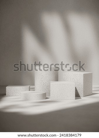 Modern elegance: Geometric, textured cement blocks, bathed in window-shaped light. Perfect for creative product placement, blending modernity and artistic allure. Elevate your brand narrative. Royalty-Free Stock Photo #2418384179