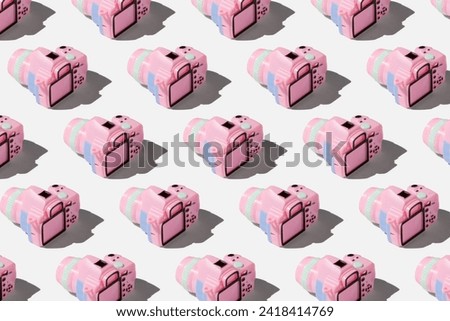 Pattern with camera on pastel color background