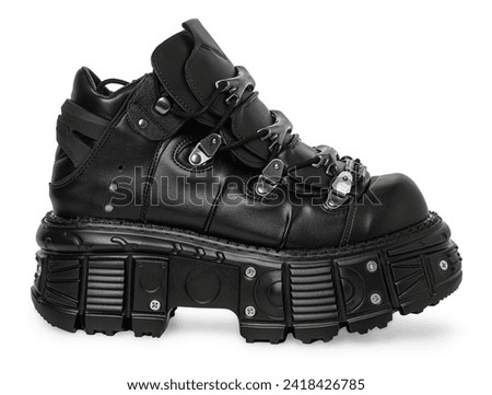 black leather high-soled grunge, hard shoes isolated on white background