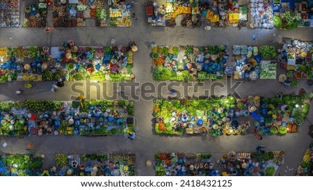 Aerial view of busy local daily life of the morning local market in Vi Thanh or Chom Hom market, Vietnam. People can seen exploring around the market. Royalty-Free Stock Photo #2418432125