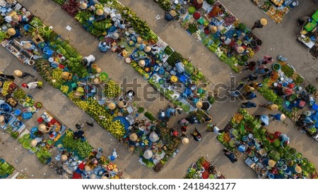 Aerial view of busy local daily life of the morning local market in Vi Thanh or Chom Hom market, Vietnam. People can seen exploring around the market. Royalty-Free Stock Photo #2418432177