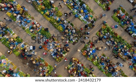 Aerial view of busy local daily life of the morning local market in Vi Thanh or Chom Hom market, Vietnam. People can seen exploring around the market. Royalty-Free Stock Photo #2418432179