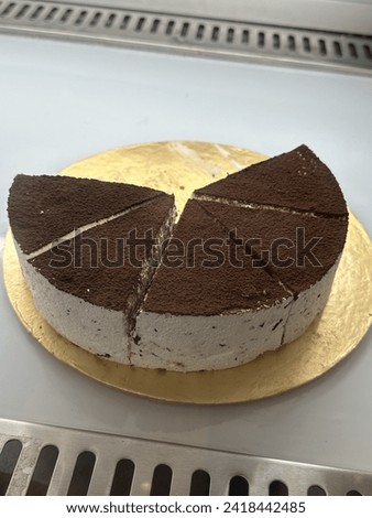 The image is a slice of chocolate cake. It is a dessert that is commonly enjoyed at celebrations like birthdays. The cake appears to be rich and sweet, making it a tempting treat for chocolate lovers.