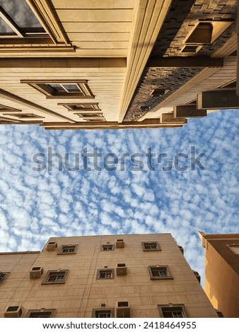 Skyline between traditional apartment buildings on the streets of Jeddah Saudi Arabia.