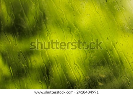 blur background of window glass wet from rain water. wet window glass background. wet glass.