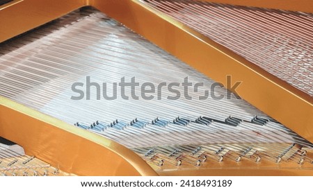 Interior of grand piano with strings