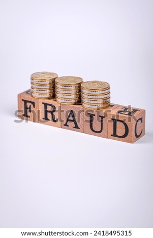 The inscription Fraud inspection made of wooden cubes on a plain background. Can be used for your design