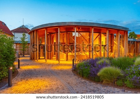 Sunset view of museum of Hans Christian Andersen in Odense, Denmark. Royalty-Free Stock Photo #2418519805