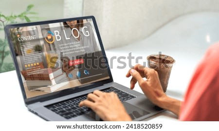 Woman ues laptop computer with social media online content, freelance worker, working online, content creator, blogger, technology, website, woman reading blog online on computer at home