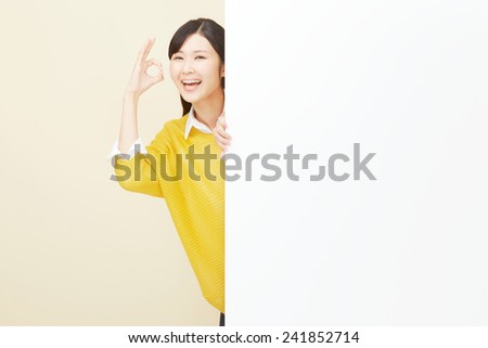 Japanese woman OK gesture with Bulletin Board