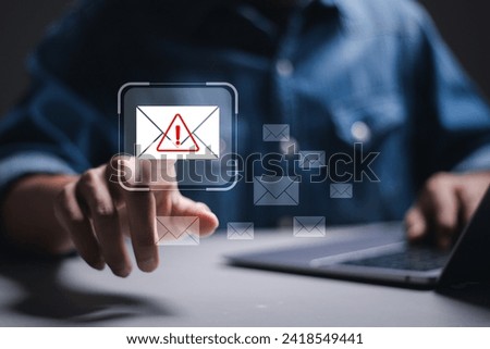Email Spam concept. Person use laptop with virtual screen of Spam email notification,  warning notification and spam message.