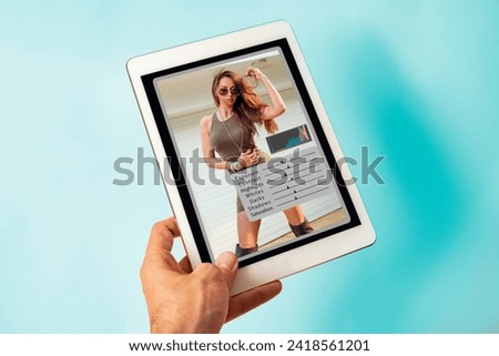 Man using photo editing software on digital tablet   