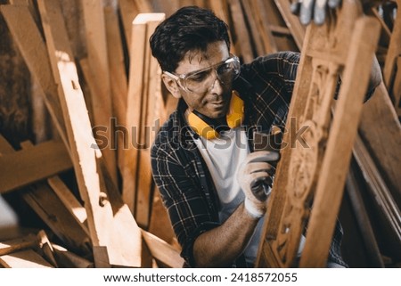 professional carpenter man hand working make wooden handcraft furniture master workpiece fine detail artisan with wood workshop. Royalty-Free Stock Photo #2418572055