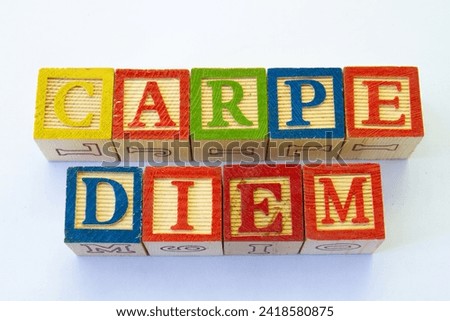 The term carpe diem displayed visually on a clear background with copy space Royalty-Free Stock Photo #2418580875