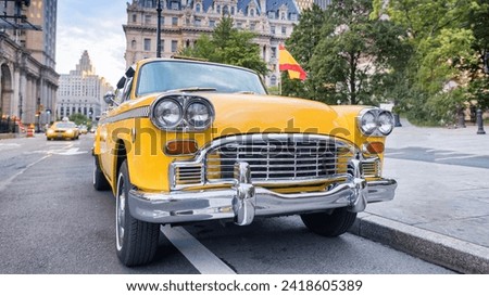 Vintage Yellow Cab in New York City - 70's Checker Taxi - Classic Car along Manhattan streets. Royalty-Free Stock Photo #2418605389
