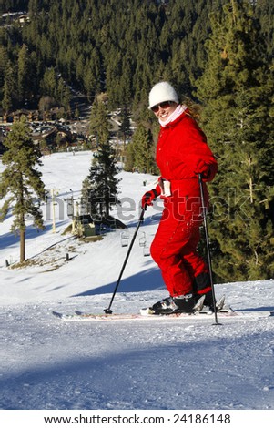 Portrait of active girl on ski in Mountains