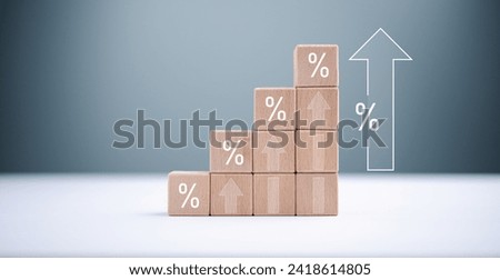 Increasing percentage sign symbol on growth wooden block stacking and arrow up for financial saving and investment, mortgage debt interest and business dividend growth concept, business finance invest