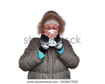 Asian woman wearing winter jacket, holding white cup in hand. Isolated on white background.