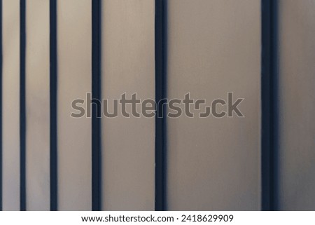 Metal facade trim with dark aluminum panels. Modern house facade and roof