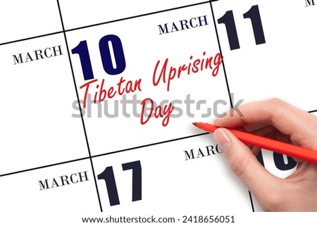 March 10. Hand writing text Tibetan Uprising Day on calendar date. Save the date. Holiday. Day of the year concept. Royalty-Free Stock Photo #2418656051
