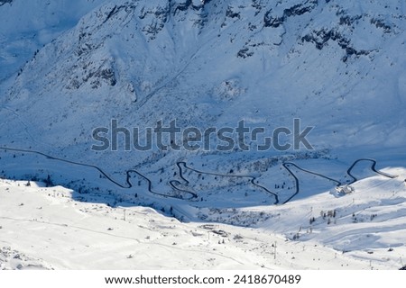 Ski resort in the Dolomites. Mountain recreation place. Ski slopes in the Dolomites on a clear sunny day. Alpine skiing sport and recreation. Royalty-Free Stock Photo #2418670489