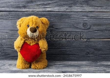 Teddy bear with a heart, vintage tone, concept of love, Valentine's Day holiday. Mothers Day.