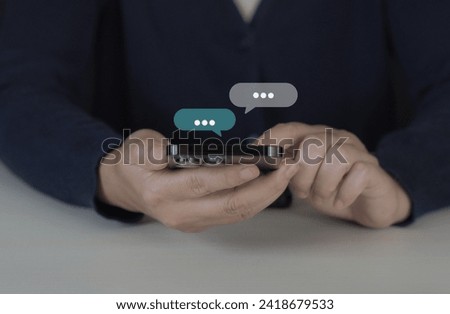 Women hand using smartphone typing Live chat chatting and social network concepts, chatting conversation working at home in chat box icons pop up. Social media marketing technology concept.