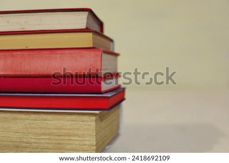 stack of books on a wooden table. high quality photo
