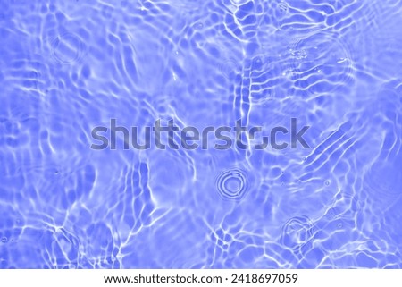 Soft focus lite purple blue gray cosmetic moisturizer floral water, micellar toner, or emulsion abstract background. Reflections of  scattered sun texture.