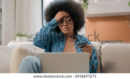 African American woman has problem with online shopping internet banking failure insufficient funds payment trouble blocked credit card girl female buyer use laptop try to pay unsuccessful scam fraud Royalty-Free Stock Photo #2418697671