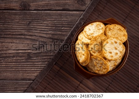Pile of rice chips snack. Rice Crackers. Royalty-Free Stock Photo #2418702367