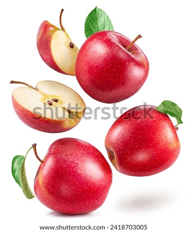 Red apples and red apples slices levitating in air isolated on white background. 