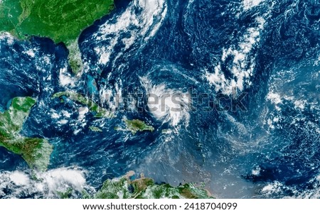 Hurricane Dorian in the Tropical Atlantic. After brushing past Puerto Rico, the storm began intensifying over open waters. Elements of this image furnished by NASA. Royalty-Free Stock Photo #2418704099