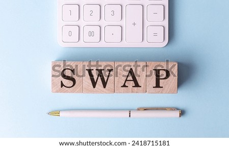 SWAP on a wooden cubes with pen and calculator, financial concept Royalty-Free Stock Photo #2418715181