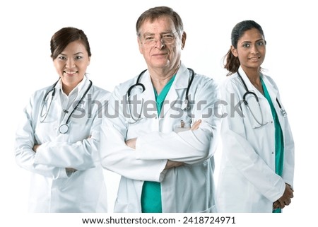 Portrait of a Mature male doctor standing with his team.