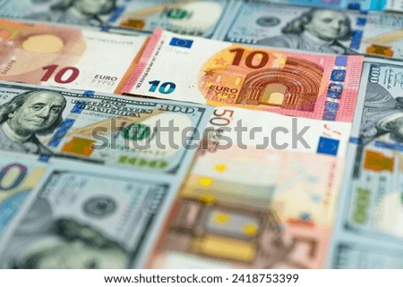 Background made of dollar and euro banknotes Royalty-Free Stock Photo #2418753399