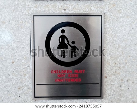 a sign or symbol of a mother accompanying her child. children must not ride unattended. Royalty-Free Stock Photo #2418755057