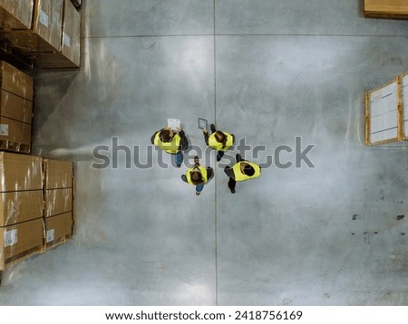 Top view of workers modern warehouse storage of retail shop, large factory workshop space. Employees in modern industrial factory with warehouse.
