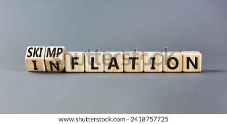 Inflation or skimpflation symbol. Concept words Inflation Skimpflation on beautiful wooden blocks. Beautiful grey table grey background. Business inflation skimpflation concept. Copy space