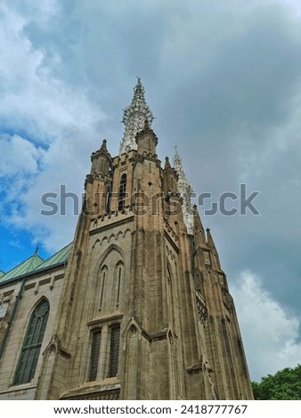 Side picture of Cathedral Catholic Church Jakarta during cloudy midday