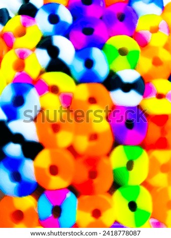 Background of circular shapes ( plastic pearls) in bright candy and orange colors