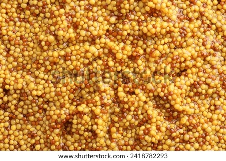 Whole grain mustard as background, top view Royalty-Free Stock Photo #2418782293