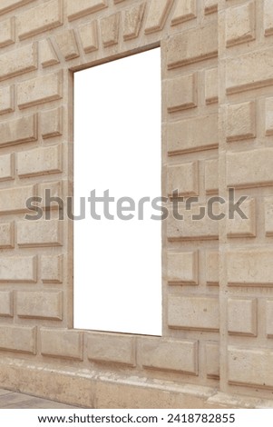 Vertical blank billboard set in a textured sandstone wall, perfect for advertisements or custom content in a historical or urban setting. Empty, copy space for your picture, text. Billboard mock up.