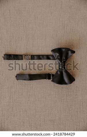 top view of black bow tie

