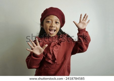 Portrait of happy smiling fooling little girl child kid hands search isolated on white color background