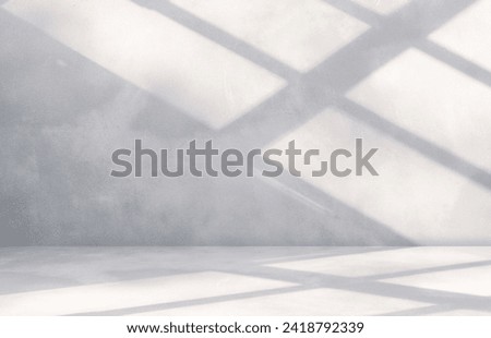 Empty grey cement wall room and floor perspective interior background with shadow light overlay well free space display product and text presentation on backdrop background  