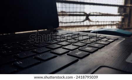 Picture of a keyboard and a mouse on top of a table 